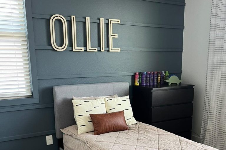 wood letters spelling child's name above bed in boy room